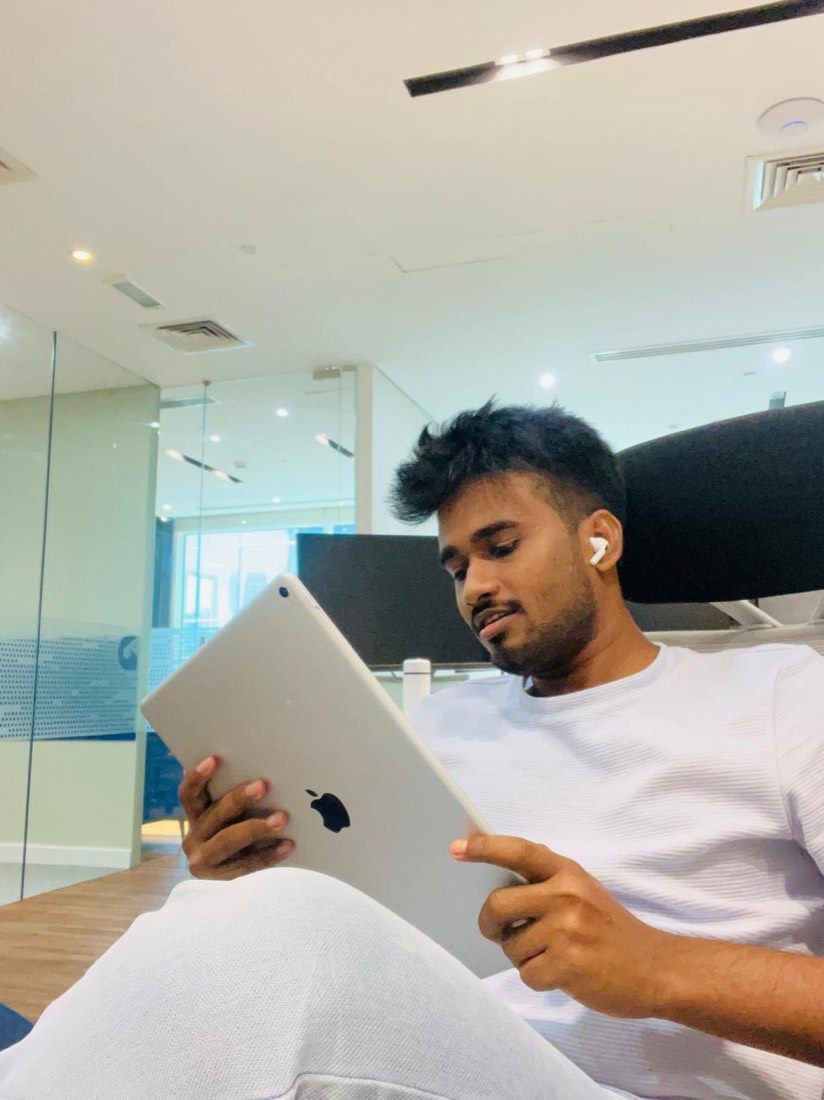 Catching up on reading in the office lounge
